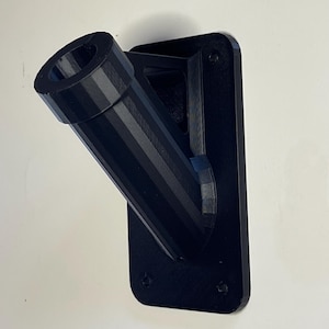 May include: Black plastic wall mount with a angled pipe for hanging a flag or banner.