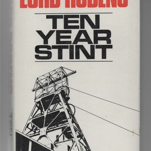 May include: A book cover with the title "Ten Year Stint" by Lord Robens. The cover features a black and white illustration of a mining headframe.