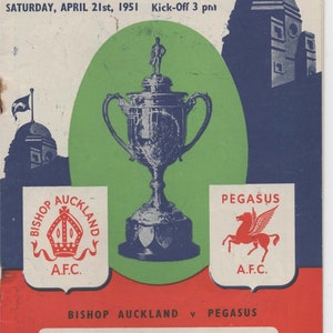 May include: A vintage program for the Amateur Cup Competition Final Tie between Bishop Auckland and Pegasus, held at Wembley Stadium on April 21st, 1951. The program features the teams' crests and the iconic Wembley trophy.