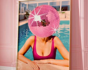May include: Framed art print featuring a person with a pink disco ball head, wearing a magenta swimsuit, leaning on a pool's edge. The artwork is set against a backdrop of a pool and a building, with a pink wall and a gold frame.
