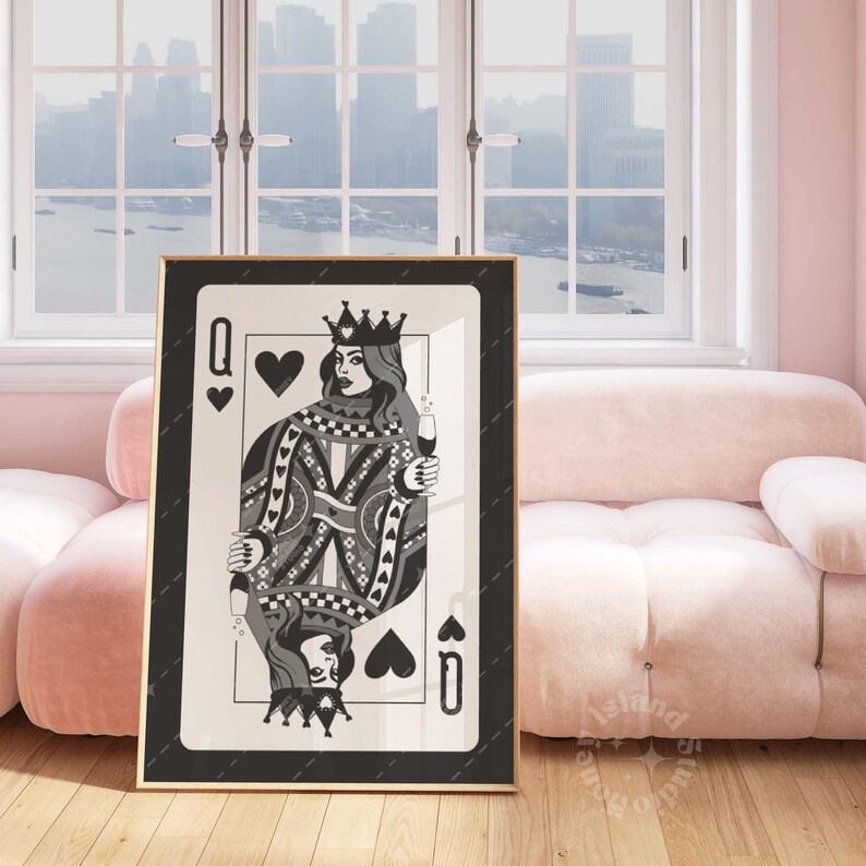 May include: A framed art print featuring the Queen of Hearts playing card design. The black and white illustration depicts a queen holding a champagne glass, with a crown and ornate details. The artwork is displayed in a gold frame.