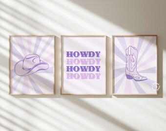 May include: Three purple and white framed prints with a cowboy hat, a pair of cowboy boots, and the word "Howdy" repeated four times.