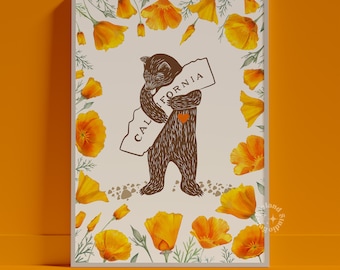 May include: A brown bear hugging a white outline of the state of California with the word "CALIFORNIA" written on it. The bear is holding a red heart in its paws. The background is white with a border of yellow California poppies.