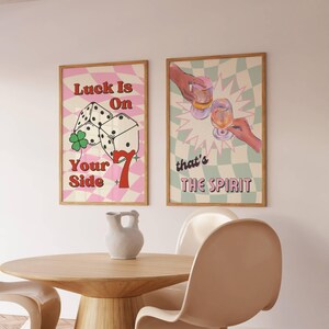 Set of 2 prints with Luck is on your side print with checkered background, dice, lucky 7 , and green clove. Print 2 has sage green checkered background, two glasses of wine,  champagne, cheers, with vintage font, that's the spirit.