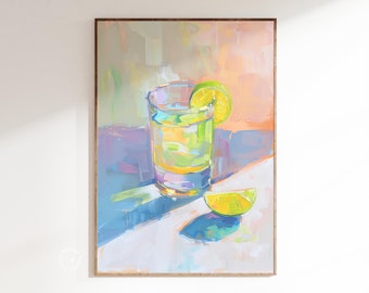 May include: A framed art print of a refreshing drink. The artwork depicts a clear glass filled with a light-colored liquid, a lime wedge, and a lime slice. The background features a colorful, abstract design with shades of blue, pink, and yellow.