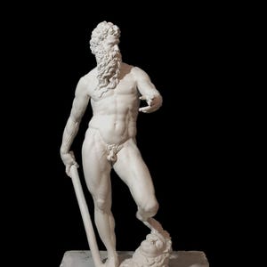 May include: A white marble statue of a man with a beard, holding a staff and standing on a head. The statue is on a white base.