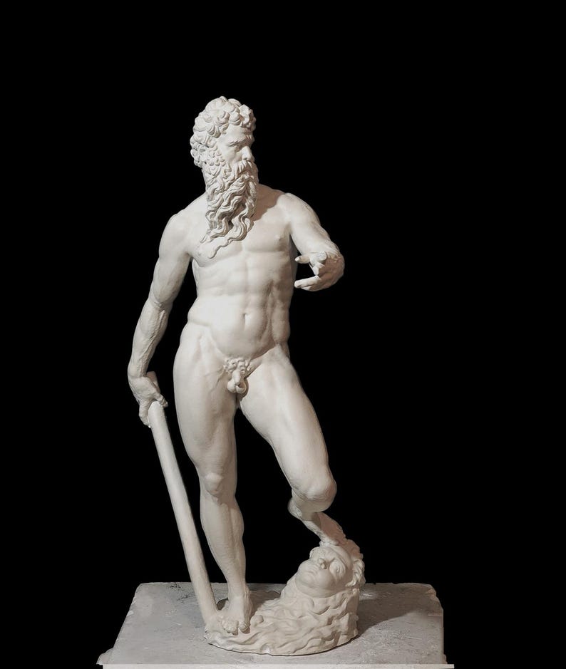 May include: A white marble statue of a man with a beard, holding a staff and standing on a head. The statue is on a white base.