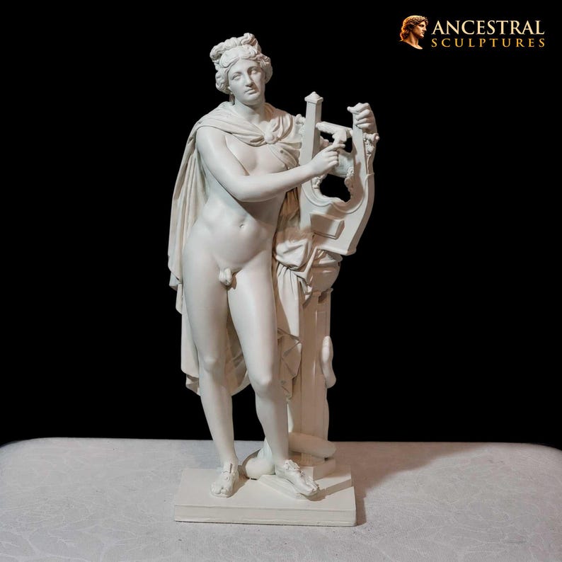 May include: A white sculpture of a nude male figure holding a lyre. The figure has a draped cloth over his shoulder and stands on a rectangular base. The sculpture is set against a black background. The text "ANCESTRAL SCULPTURES" is in the upper right corner.