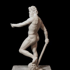 May include: A white plaster sculpture of a nude male figure with a beard and curly hair. The figure is standing with one leg raised and holding a staff in his right hand.