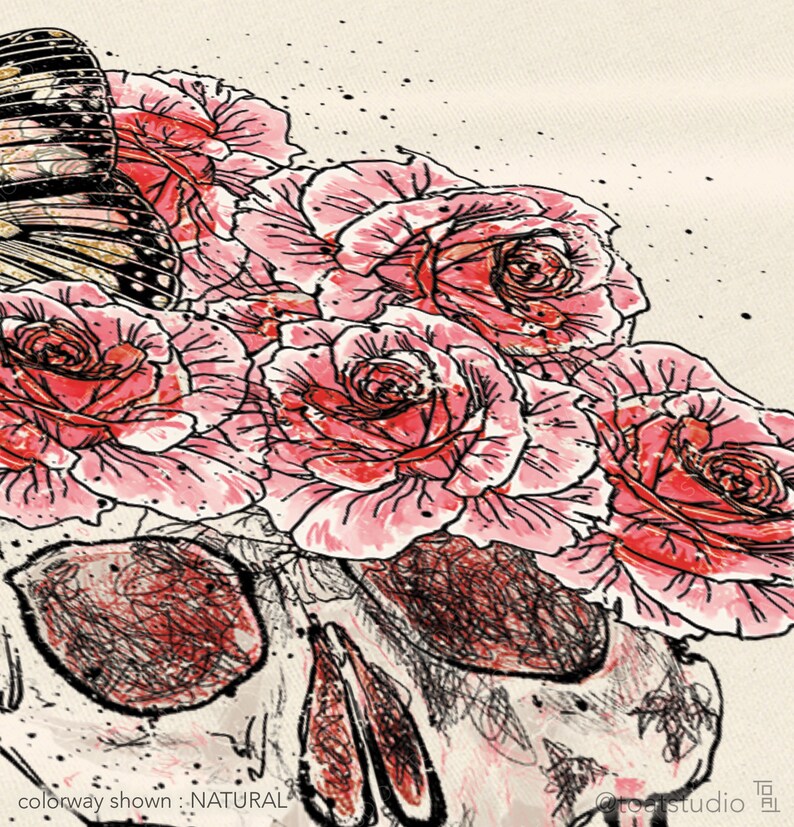 May include: Illustration of a skull with a bouquet of pink roses and a butterfly. The artwork is in a watercolor style with black outlines and a natural colorway. The text "colorway shown: NATURAL" is visible.