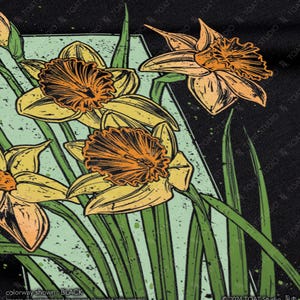 May include: A black t-shirt with a graphic print of yellow and orange daffodils with green stems and leaves on a black background.