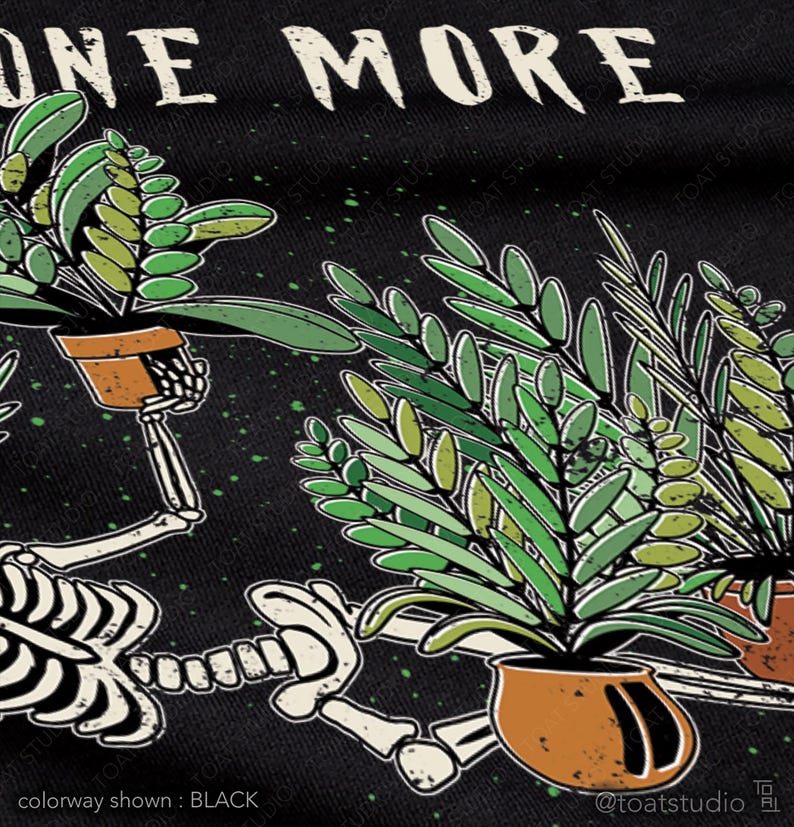 May include: Black graphic tee with the text "ONE MORE" above a skeleton holding potted plants. The skeleton is white, and the plants are green with brown pots. The text "colorway shown: BLACK" is at the bottom.