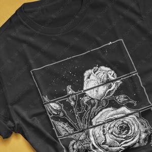 May include: Black t-shirt featuring a detailed black and white rose graphic. The design is segmented into three rectangular panels, showcasing the flower's intricate details. The shirt's colorway is black.