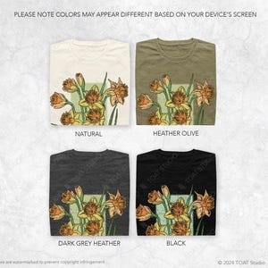 May include: Four different color t-shirts with a floral design featuring yellow daffodils. The colors are natural, heather olive, dark grey heather, and black.