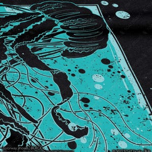 May include: Black and turquoise blue graphic design of a jellyfish with tentacles on a black background. The design has a distressed, vintage look.