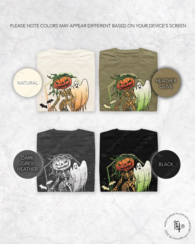 May include: Four folded t-shirts in natural, heather olive, dark grey heather, and black. Each shirt features a Halloween design with a pumpkin-headed skeleton and a ghost. The text "PLEASE NOTE COLORS MAY APPEAR DIFFERENT BASED ON YOUR DEVICE'S SCREEN" is at the top.