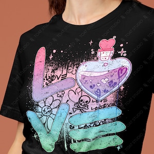 May include: Black t-shirt with a colorful "LOVE" graphic. The design includes a heart-shaped potion bottle, hearts, a skull, and a flower. The word "LOVE" is in a gradient of colors.