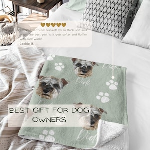 May include: A soft green throw blanket with a white paw print pattern. The blanket features a personalized image of a dog with the name "Didi" printed on it. The text "BEST GIFT FOR DOG OWNERS" is printed on the blanket.