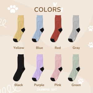 May include: A set of 10 pairs of socks in various colors, including yellow, blue, red, gray, black, purple, pink, and green. The socks are all crew length and have a black heel and toe.