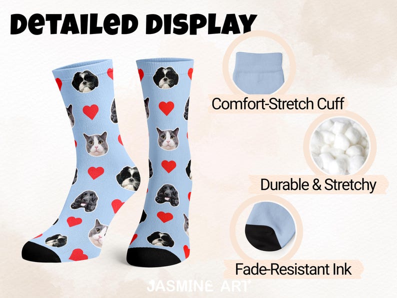 May include: Light blue socks with a pattern of dog and cat faces and red hearts. The socks have black heels and toes. The text "DETAILED DISPLAY" is at the top. The socks are described as having a comfort-stretch cuff, durable and stretchy, and fade-resistant ink.
