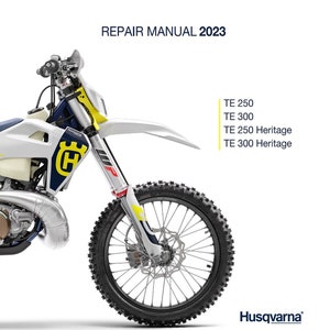 May include: A white and blue Husqvarna motorcycle with a yellow and black front fork. The motorcycle is a dirt bike with a large front wheel and a smaller rear wheel. The text "REPAIR MANUAL 2023" is at the top of the image. The text "TE 250", "TE 300", "TE 250 Heritage", and "TE 300 Heritage" is listed below the motorcycle. The text "Husqvarna" is at the bottom of the image.