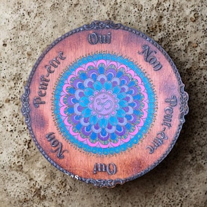 Hand-painted engraved wooden mandala pendulum board for divination, dowsing, chakra energy, yes/no/maybe answers, and intuitive guidance.