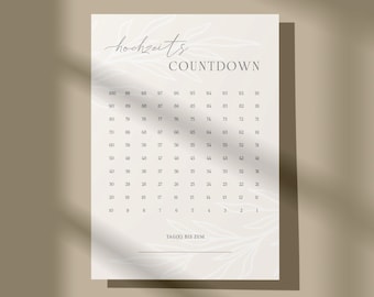 May include: A printable wedding countdown calendar with a white background and a simple design. The calendar features a grid of numbers from 100 to 1, with the text "hochzeits COUNTDOWN" at the top and "TAG BIS ZUM" at the bottom.