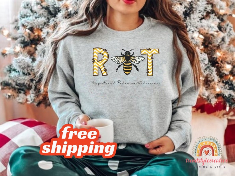 May include: Gray sweatshirt with a bee graphic and the text "RBT Registered Behavior Technician".