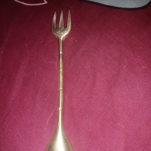 Hand-forged brass medieval fork and spoon set with twisted handles, designed for Viking or historical reenactment, LARP, or cosplay use.