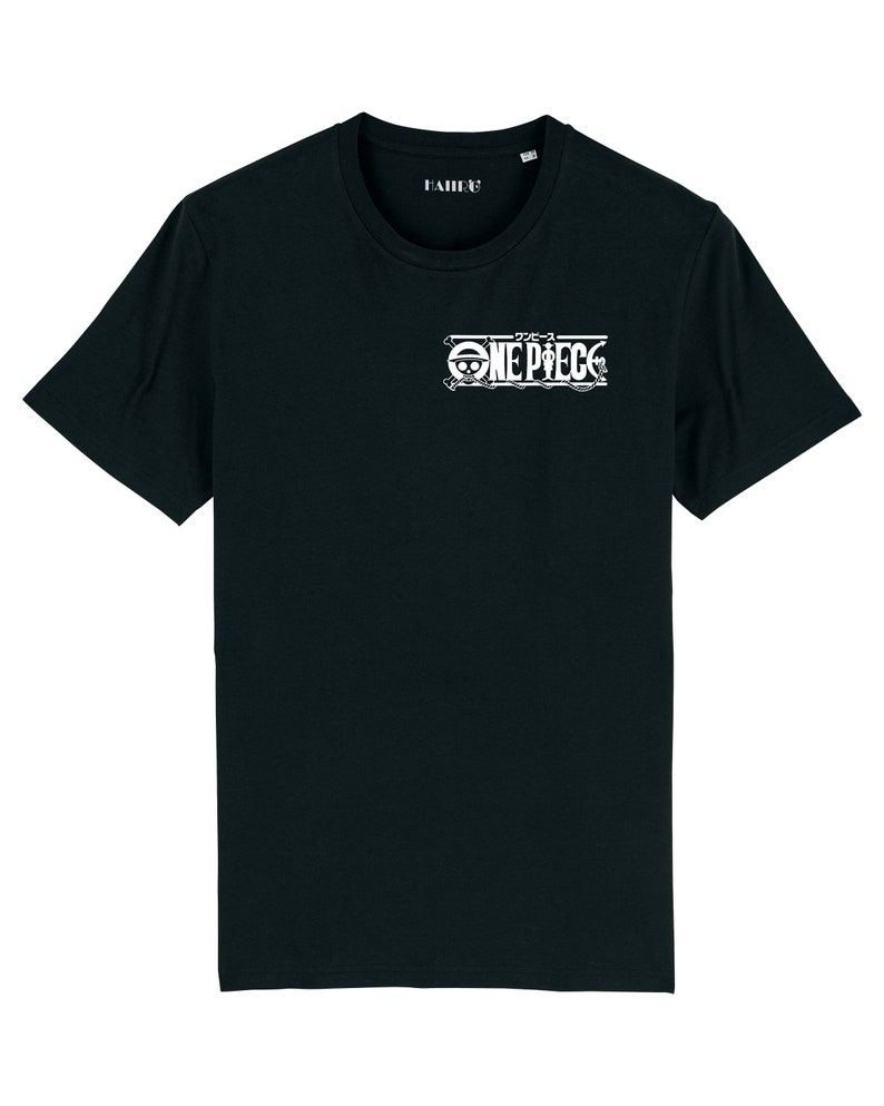 May include: Black t-shirt with a white graphic of the "One Piece" logo, featuring the Japanese text "ワンピース" above the logo.