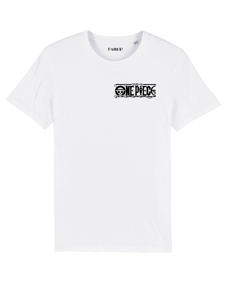 May include: White t-shirt with a black One Piece logo on the front. The logo includes the Japanese characters for "One Piece" and a skull and crossbones.