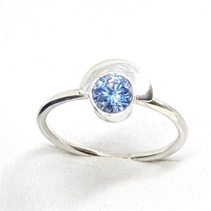 Solid silver ring, half-moon, blue Swarovski zirconium oxide