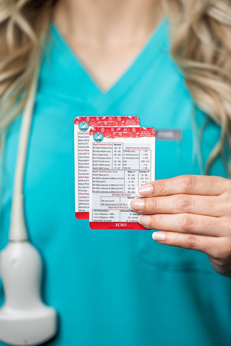 May include: Two white cards with red and blue text and graphics. The cards contain information about right ventricle size and function, including measurements in centimeters and millimeters. The cards are held by a person's hand.