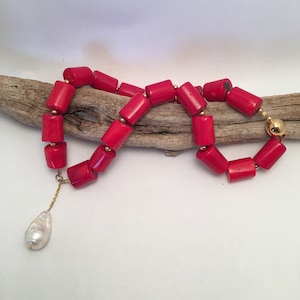 Red coral and a baroque pearl necklace.