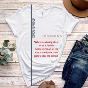 May include: White t-shirt with instructions on how to measure chest size in inches. The text reads "When measuring chest, wrap a flexible measuring tape all the way around your chest going under the armpit."