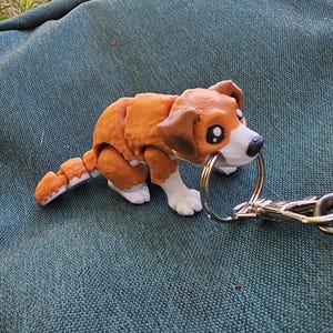 Ledad hundnyckelring, fidgetleksak för hundar, dragkedjedragare, stressleksak, ryggsäck, väskberlock