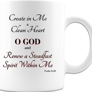 May include: White ceramic mug with black text that reads "Create in Me a Clean Heart O GOD and Renew a Steadfast Spirit Within Me" and "Psalm 51:10".