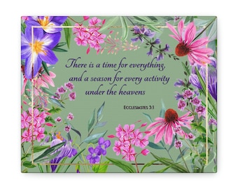 May include: A green canvas print with a floral design featuring purple, pink, and white flowers. The print includes the text "There is a time for everything, and a season for every activity under the heavens" and "Ecclesiastes 3:1".