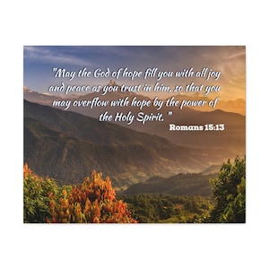 May include: A motivational quote about hope and peace from Romans 15:13, set against a scenic backdrop of a mountain range at sunset. The quote reads, "May the God of hope fill you with all joy and peace as you trust in him, so that you may overflow with hope by the power of the Holy Spirit."