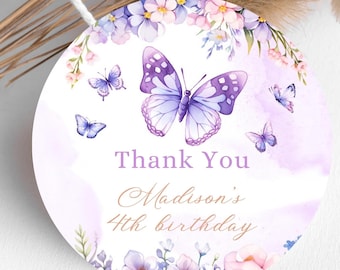 May include: Round purple and white thank you tag with a purple butterfly and floral design. The text reads "Thank You Madison's 4th birthday".