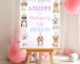 May include: A welcome sign for a 5th birthday party, featuring watercolor illustrations of dogs wearing party hats. The sign reads "Come, sit & stay" and "Welcome to Madison's 5th Birthday" in a playful font, set against a pastel background.