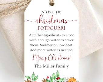 May include: A white rectangular gift tag with twine, featuring the text STOVETOP christmas POTPOURRI, instructions for simmering, Merry Christmas!, and The Miller Family. The bottom border displays watercolor illustrations of orange slices, berries, and leaves.