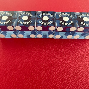 Stunning custom personalized playing dice. Professional “Casino grade” razor edge dice in a set of 5 die per set in multiple color schemes.