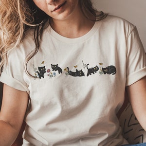 Cute Cat Graphic Tee, Playful Black Cat Floral Butterfly Shirt