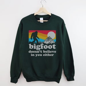 Bigfoot Doesn't Believe In You Either Crewneck Sweatshirt, Unisex Funny Sasquatch Sweatshirt Forest Green