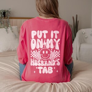 Put It On My Husbands Tab Front And Back Long Sleeve Comfort Colors Shirt