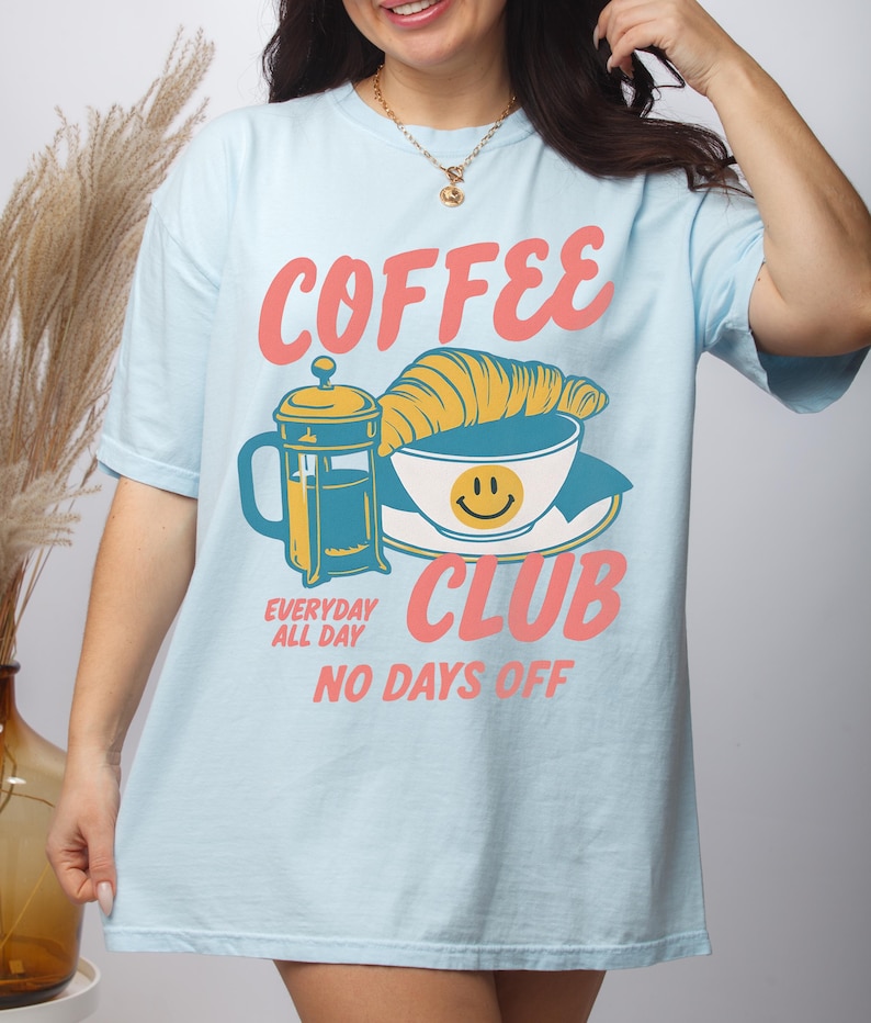 Coffee Club T-Shirt – Retro Coffee Lover Graphic Tee with Croissant And French Press – Cozy Aesthetic Gift Chambray