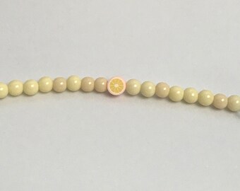 Yellow beads with lemon charm bracelet
