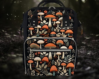 May include: A black canvas backpack with a mushroom and floral pattern. The backpack has a large main compartment and a smaller front pocket.