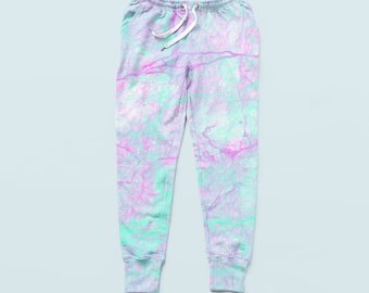 May include: A pair of light blue sweatpants with a pink and green marble pattern.